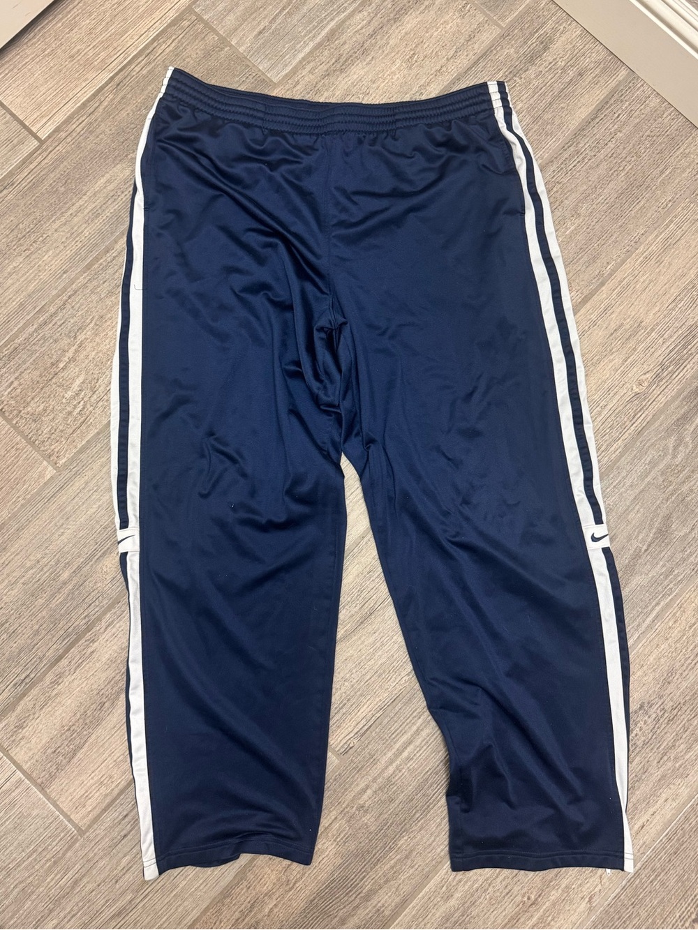 Nike Men's Navy Athletic Track Pants with White Stripes and Zipper Bottoms